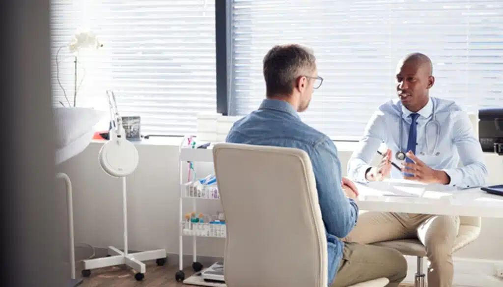 Doctor explaining health services to another person