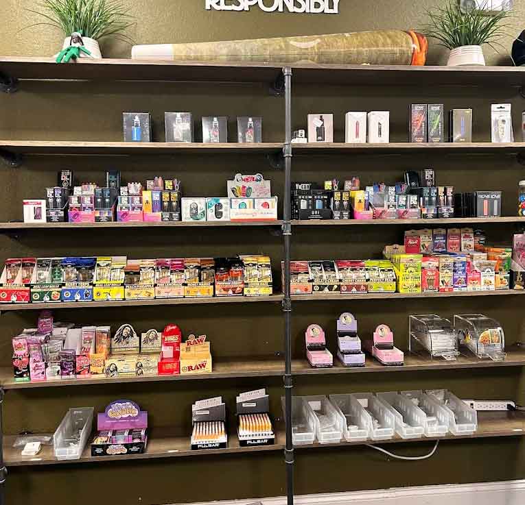 # Alt Text

Retail shelves displaying cannabis products, edibles, and accessories in organized dispensary display