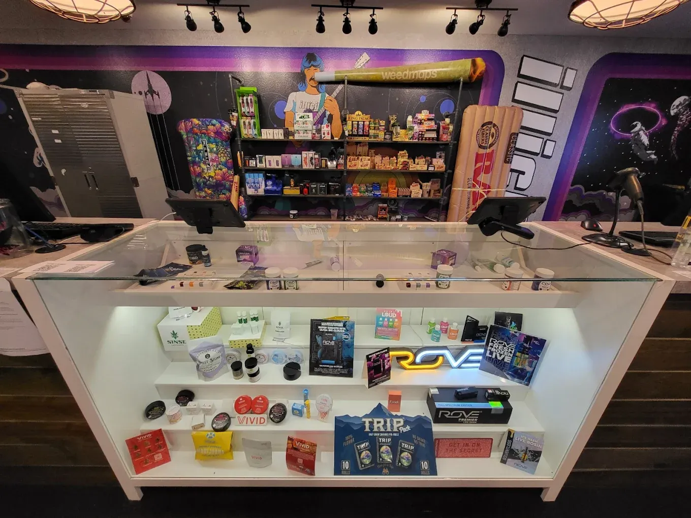 Cannabis products and accessories displayed on counter in dispensary retail setting
