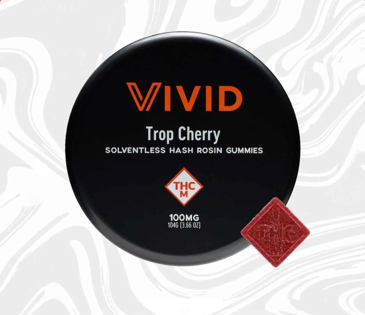 VIVID Tung Cherry cannabis product packaging with label and red cube on black background